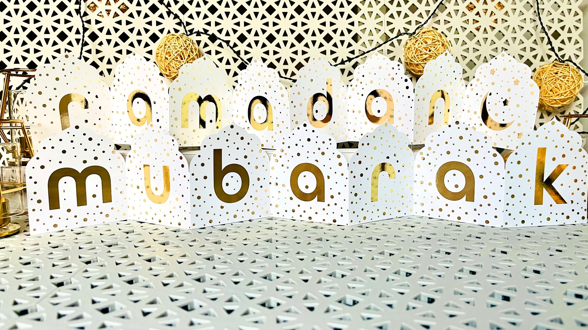 Decorative banner with 'ramadan mubarak' text on a textured surface.