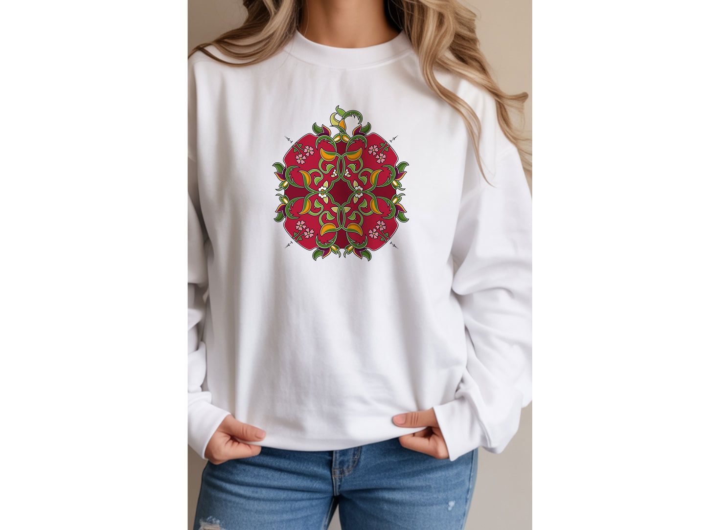 White sweatshirt with a colorful Pomegranate design worn by a person.